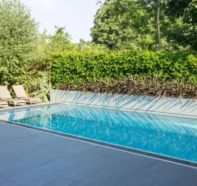 Poolcraft Ltd - a luxury outside exercise lap pool with stove paving surround