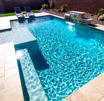 Poolcraft Ltd - Inground outside with water feature, sunken shelves and tile surround