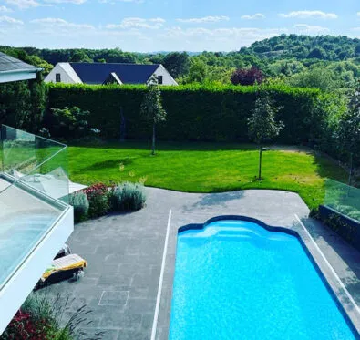 Poolcraft Ltd - An inground outside pool with a roman style end