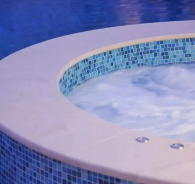 Poolcraft Ltd - close up of a circular mosaic spa in a pool