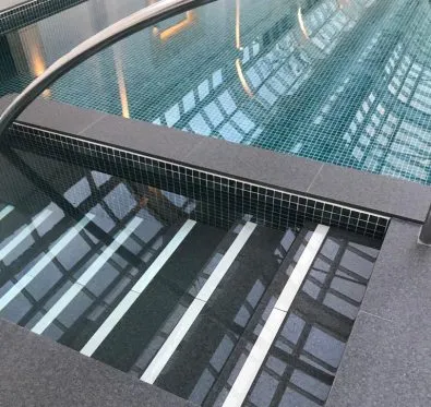 PoolCraft Ltd - Indoor swimming pool renovation in Weybridge with newly added built in steps